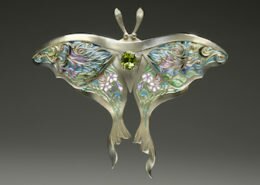 Linda Caristo, Jeweler in Fairview, NC, creates delicate translucent resin within hand pierced cells to create unique jewelry in an array of colors inspired by the natural beauty of Western North Carolina.