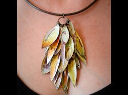 Annie Grimes Williams, jeweler in Winston-Salem, NC, creates unique colorful earrings, necklaces and bracelets using traditional metalsmithing and enameling