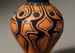 Garry Childs - Potter from Rougemont, NC - creates functional terra cotta wheel-thrown pots with carved patterns and layers of colorful glaze and pigments.