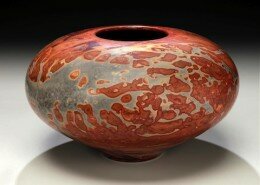 Jim Whalen, Potter in Horseshoe, NC, creates wheel thrown pots in a simple rounded form. Burnishing, terra sigliata, salt or sawdust yield earth toned patterns.