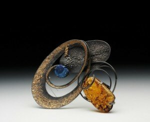 Tai Kim, Jeweler inspired by nature, creates jewelry using oxidized silver, overlaid with platinum or 24k gold with a subtle texture and diffused color.