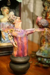 Artist Chrissie Callejas' Ceramic Figure at the Carolina Artisan Craft Market